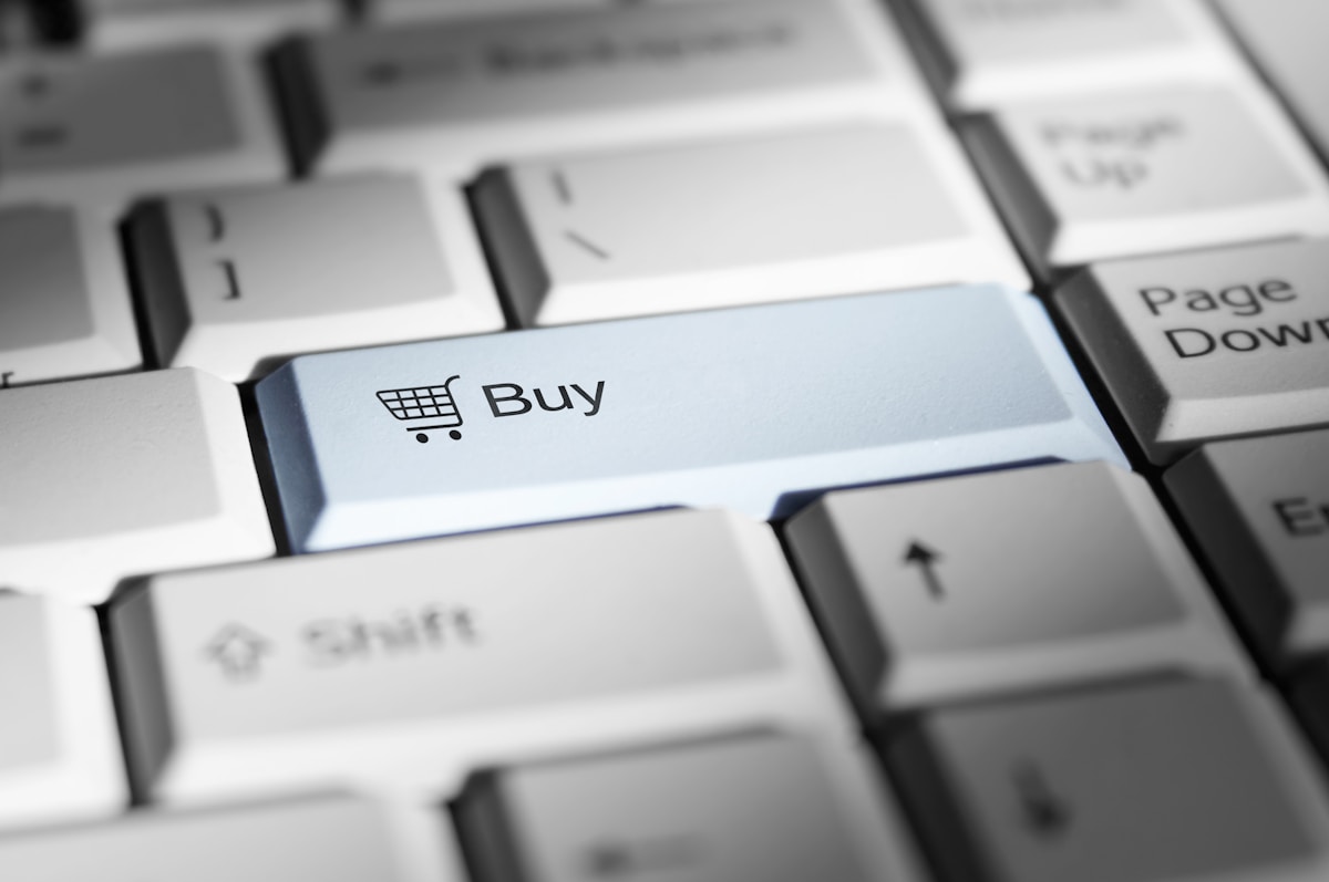 Buy button on keyboard representing e-commerce development