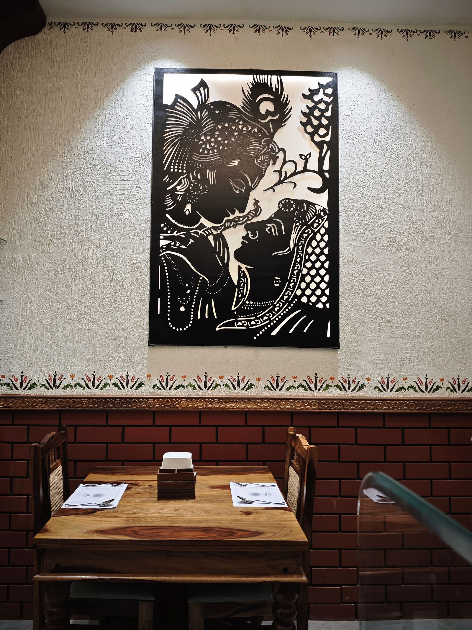 Restaurant table setting with traditional wall art decor