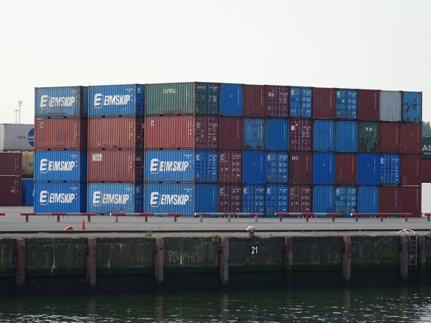Stacked shipping containers ready for export from an Indian manufacturing hub